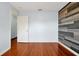 Spacious bedroom with wood flooring and access to another room at 1633 Corner Meadow Cir, Orlando, FL 32820