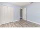 Bedroom featuring neutral wall color with bi-fold closet doors and light gray flooring at 1633 Corner Meadow Cir, Orlando, FL 32820