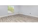 Neutral bedroom with hard surface flooring and a bright window at 1633 Corner Meadow Cir, Orlando, FL 32820