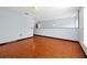 Bright bedroom featuring wood flooring and a view to another room at 1633 Corner Meadow Cir, Orlando, FL 32820