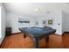 Relaxing game room with a pool table and wood flooring at 1633 Corner Meadow Cir, Orlando, FL 32820