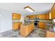 Kitchen with wood cabinets, granite countertops, and stainless steel appliances at 1633 Corner Meadow Cir, Orlando, FL 32820