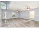 Bright living room features hard surface floors, ceiling fans, and lots of natural light at 1633 Corner Meadow Cir, Orlando, FL 32820