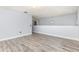 Neutral loft area featuring hard surface floors and hanging light fixture at 1633 Corner Meadow Cir, Orlando, FL 32820