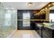 Luxurious bathroom with a glass-enclosed shower, marble accents, and modern fixtures at 1633 Corner Meadow Cir, Orlando, FL 32820