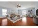 Spacious bedroom with hardwood floors, modern furnishings, and large windows offering plenty of natural light at 1633 Corner Meadow Cir, Orlando, FL 32820
