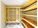 Walk-in pantry featuring custom shelving and tiled floor at 1633 Corner Meadow Cir, Orlando, FL 32820