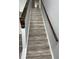 Elegant staircase with stained wood railing and decorative accents at 1633 Corner Meadow Cir, Orlando, FL 32820