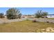 Large backyard with a spacious lawn and block wall at 1719 North W Blvd, Davenport, FL 33837