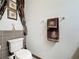 Bathroom featuring tile accents, toilet, and towel rack at 1719 North W Blvd, Davenport, FL 33837