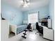 Light blue bedroom featuring a single bed and workout bench at 1719 North W Blvd, Davenport, FL 33837