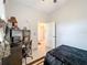 Bedroom with a workspace and a bed, offering versatility at 1719 North W Blvd, Davenport, FL 33837