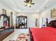 Spacious bedroom with a king-size bed and an ornate armoire at 1719 North W Blvd, Davenport, FL 33837