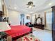 Spacious bedroom with a large bed, dresser, and seating area at 1719 North W Blvd, Davenport, FL 33837