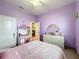 Bright bedroom with double bed and built-in desk at 1719 North W Blvd, Davenport, FL 33837