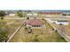 Aerial view of a tan house and backyard at 1719 North W Blvd, Davenport, FL 33837
