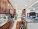 Open kitchen features granite island and stainless steel appliances at 1719 North W Blvd, Davenport, FL 33837