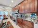 Modern kitchen with dark wood cabinets and granite countertops at 1719 North W Blvd, Davenport, FL 33837