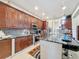 Spacious kitchen with stainless steel appliances and granite countertops at 1719 North W Blvd, Davenport, FL 33837