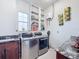 Laundry room with washer, dryer, and built-in storage at 1719 North W Blvd, Davenport, FL 33837