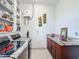 This laundry room has a granite countertop, cabinet storage, and shelving for supplies at 1719 North W Blvd, Davenport, FL 33837