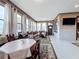 Relaxing living area with ample seating and large windows overlooking the backyard at 1719 North W Blvd, Davenport, FL 33837