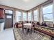 Living room features cushioned seating, several windows, and an area rug at 1719 North W Blvd, Davenport, FL 33837