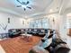 Spacious living room with a large sectional sofa and a brown rug at 1719 North W Blvd, Davenport, FL 33837