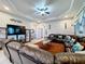 Living area with sectional sofa, flat screen TV, and decorative accents at 1719 North W Blvd, Davenport, FL 33837