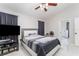 Bright bedroom with ceiling fan and ensuite bathroom access at 2463 Hybrid Dr, Kissimmee, FL 34758