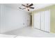 Spacious bedroom with double door closet and ceiling fan at 2463 Hybrid Dr, Kissimmee, FL 34758