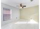 Well-lit bedroom featuring a ceiling fan and neutral walls at 2463 Hybrid Dr, Kissimmee, FL 34758