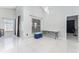 Living room with tile floors, table, and large window at 2463 Hybrid Dr, Kissimmee, FL 34758