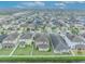 Aerial view of community with lake and houses at 2516 Nouveau Way, Kissimmee, FL 34741