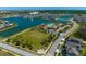 Community overview featuring lake, pool, and residential homes at 2516 Nouveau Way, Kissimmee, FL 34741
