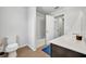 Bathroom with tiled shower, bathtub, and dark vanity with sink at 2516 Nouveau Way, Kissimmee, FL 34741