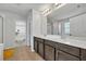 Double vanity bathroom with walk-in shower at 2516 Nouveau Way, Kissimmee, FL 34741