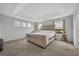 Primary suite with large bed and window views at 2516 Nouveau Way, Kissimmee, FL 34741