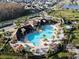 Resort-style community pool with lounge chairs and cabanas at 2516 Nouveau Way, Kissimmee, FL 34741