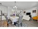 Bright dining room with gray chairs and a view to the living room at 2516 Nouveau Way, Kissimmee, FL 34741