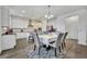 Dining area with gray chairs and patterned rug at 2516 Nouveau Way, Kissimmee, FL 34741