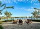 Firepit with Adirondack chairs overlooking a scenic lake at 2516 Nouveau Way, Kissimmee, FL 34741