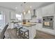 Modern kitchen with granite countertops, stainless steel appliances, and an island at 2516 Nouveau Way, Kissimmee, FL 34741