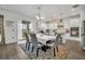 Kitchen with white cabinets, granite counters, and island at 2516 Nouveau Way, Kissimmee, FL 34741