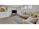 Spacious living area with sectional sofa and large TV at 2516 Nouveau Way, Kissimmee, FL 34741
