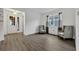 Living area with gray chairs and wood-look floors at 2516 Nouveau Way, Kissimmee, FL 34741
