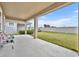 Covered patio with backyard access, perfect for outdoor relaxation at 2516 Nouveau Way, Kissimmee, FL 34741