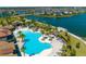 Community pool with lounge chairs and a relaxing atmosphere at 2516 Nouveau Way, Kissimmee, FL 34741