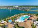 Resort-style pool with a large deck and surrounding landscaping at 2516 Nouveau Way, Kissimmee, FL 34741
