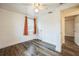 Bright bedroom with wood-look floors and an adjacent room at 277 Debary Dr, Debary, FL 32713